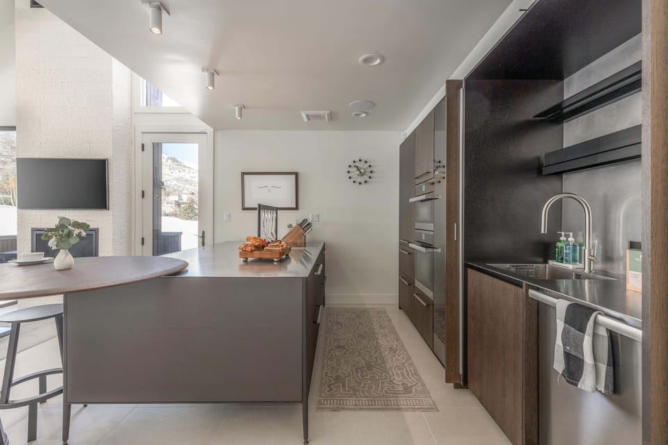 Fully Equipped Kitchen with gorgeous countertops, stainless steel appliances - including double ovens - and bar seating for two