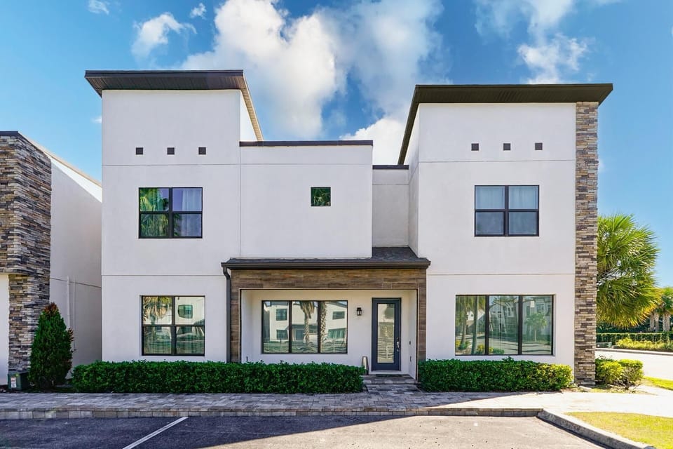 A charming exterior that welcomes you with its inviting porch and lush landscaping.