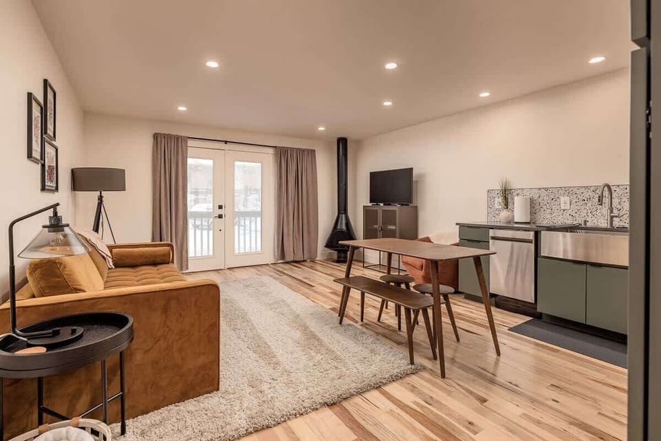Plenty of lighting and natural wood floors