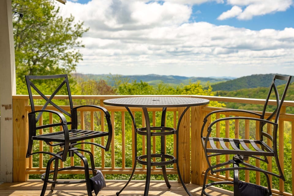 Private deck seating with panoramic Blue Ridge Mountain views in Seven Devils, NC