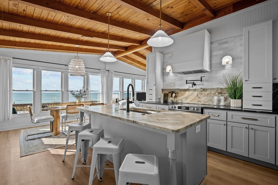 Ocean view from the Chef's kitchen with an island, pot filler and high-end vent hood.