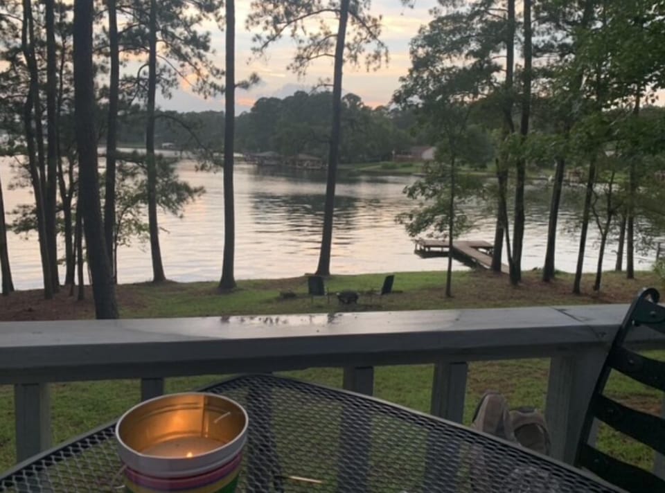Serene lake view including one of the two private lake docks on property. 