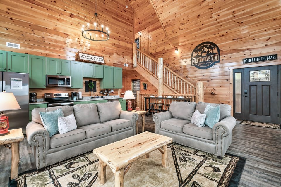 Spacious open-floor concept with vaulted ceiling and floor-to-ceiling windows.