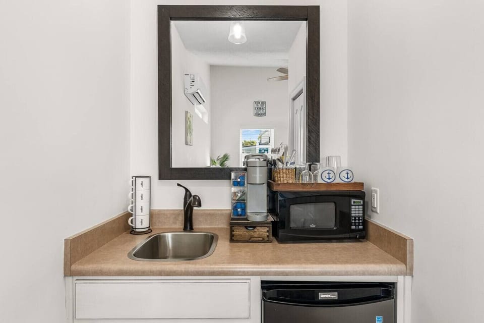 Kitchenette with mini fridge, microwave and coffee maker