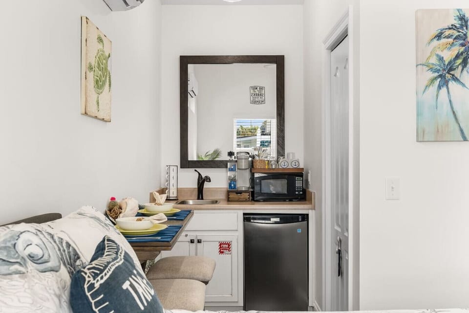 Kitchenette with mini fridge, microwave and coffee maker