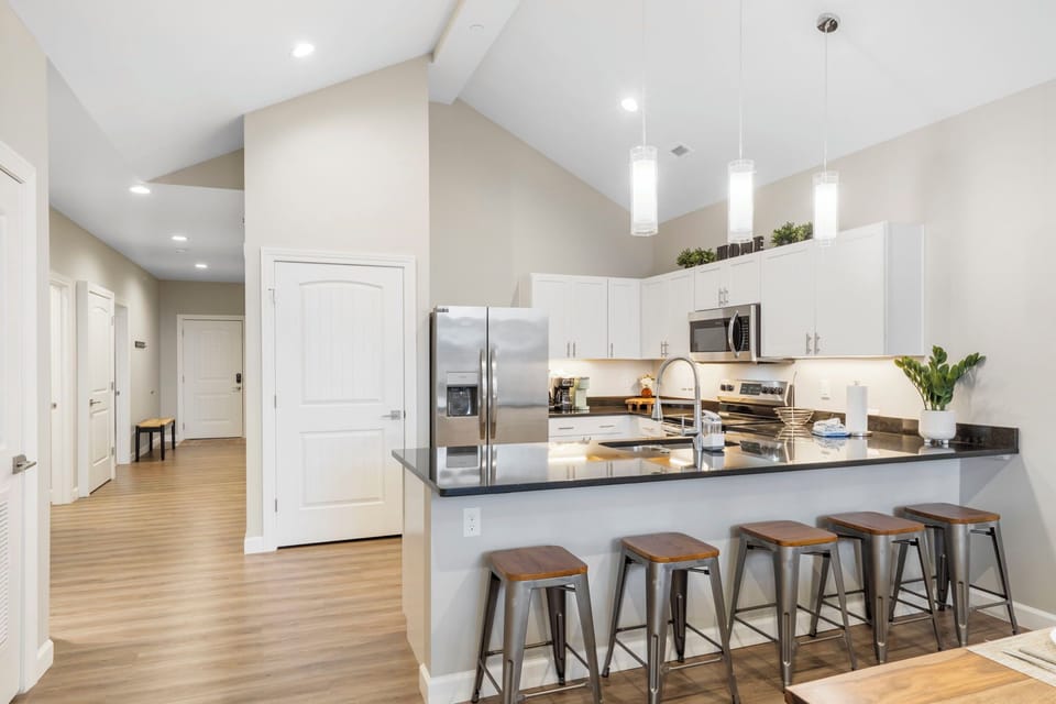 Full Kitchen with Upgraded Appliances and Additional Bar Seating