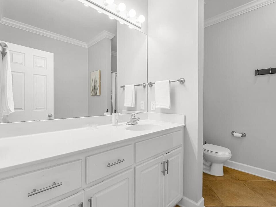 Master Bathoom attached to the King Bedroom, includes a bathtub, shower, and toilet