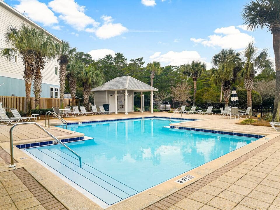 Large Neighborhood pool in Old Florida Village with bathrooms.  Just steps outside the home.