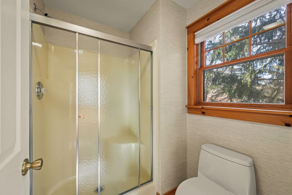 Additional shower/tub combo in the ensuite bathroom.