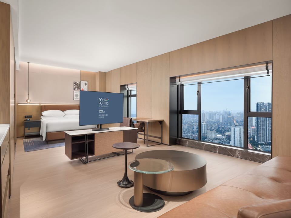 Suite, 1 Bedroom (View) | Desk, soundproofing, WiFi (free), bed sheets
