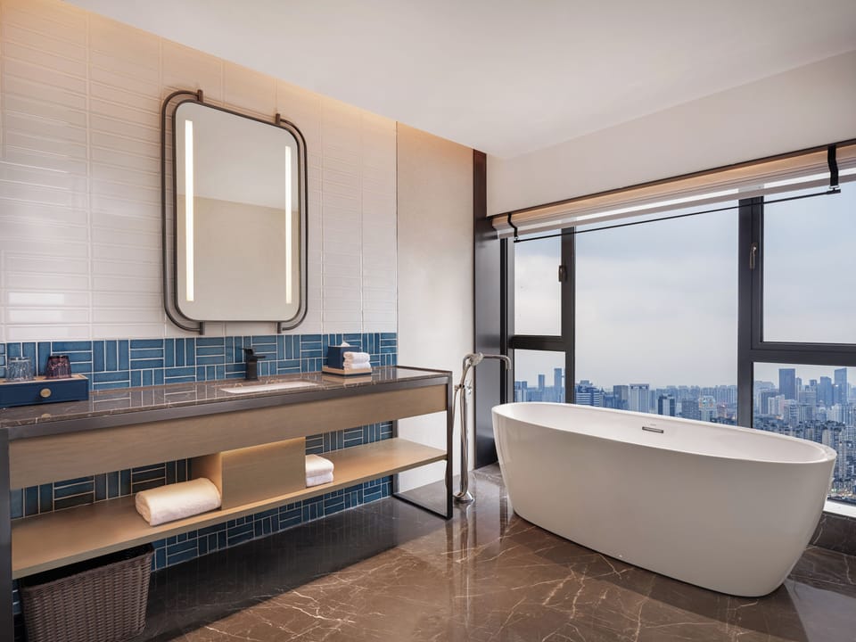 Suite, 1 Bedroom (View) | Bathroom | Free toiletries, hair dryer, slippers, towels