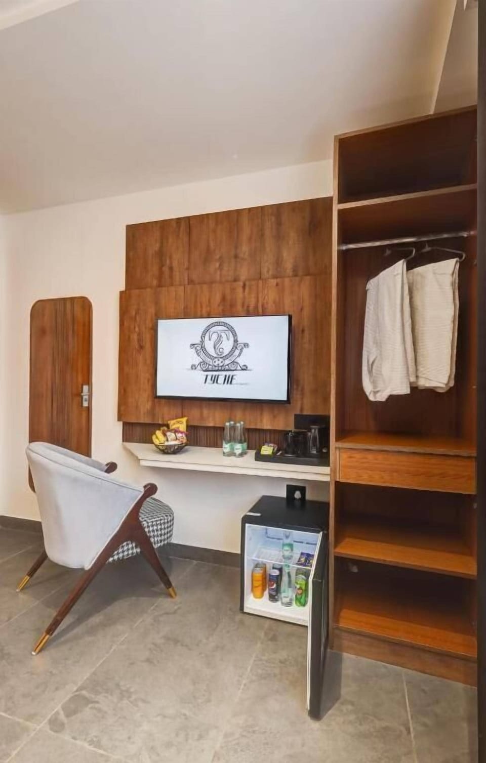 Tyche Suites - With City View | Living area | 12-inch flat-screen TV with cable channels, printers