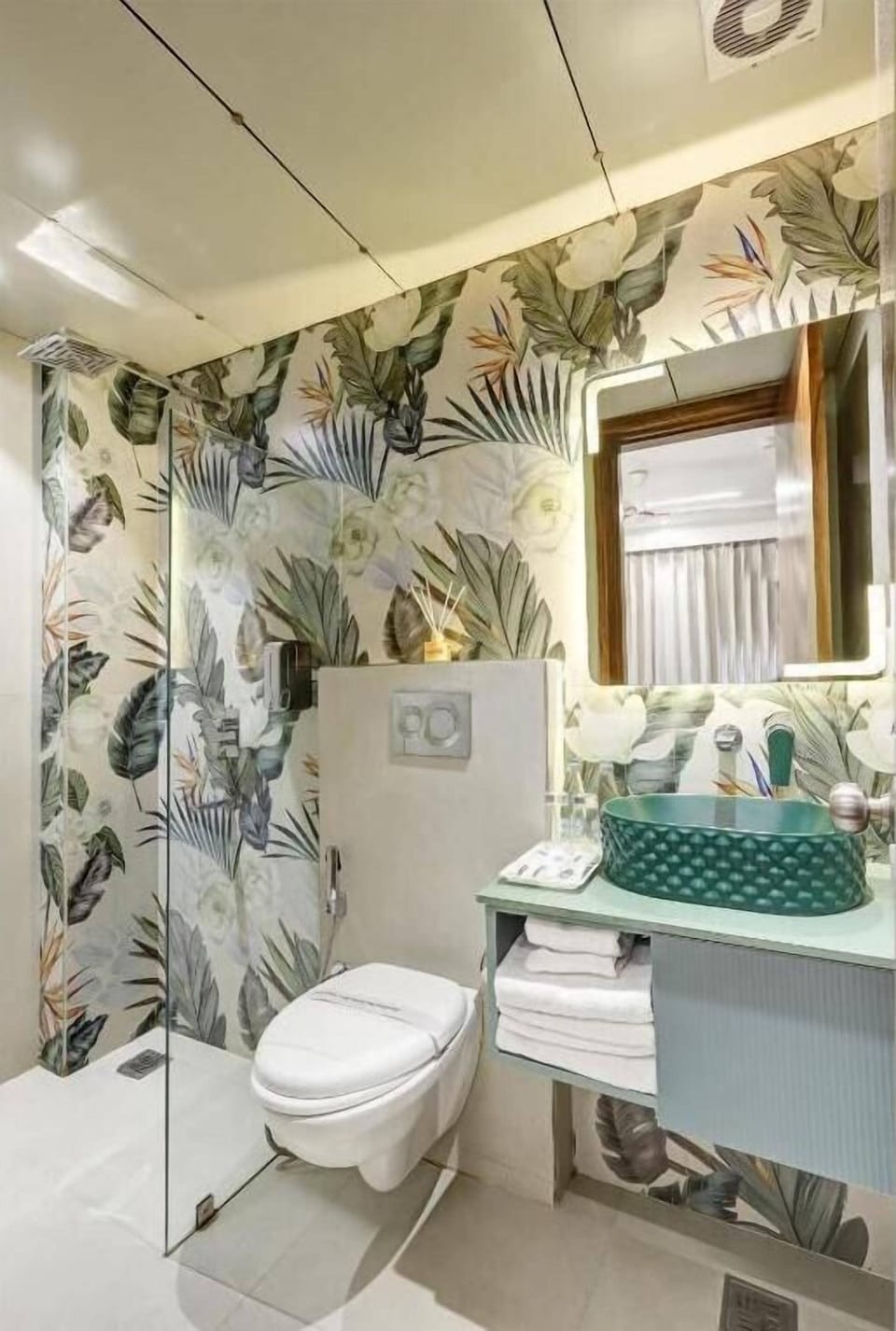 Tyche Boutique Room | Bathroom | Hydromassage showerhead, designer toiletries, hair dryer, bathrobes