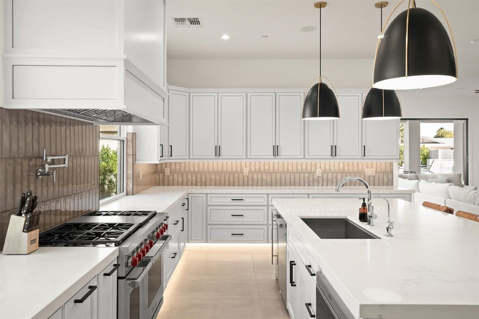Bright and modern kitchen with stainless steel appliances.

