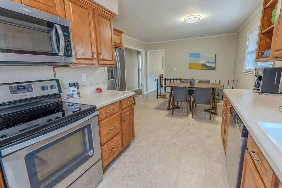 Kitchen with stainless steel appliances and wooden cabinets