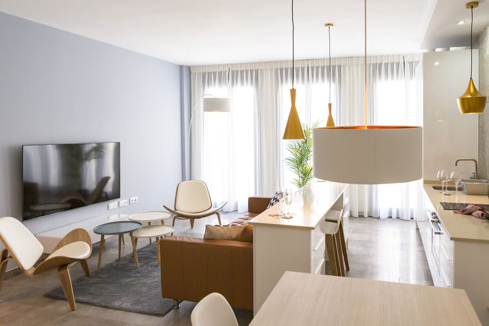 Comfort Apartment, City View | Living area | 70-inch LCD TV with cable channels
