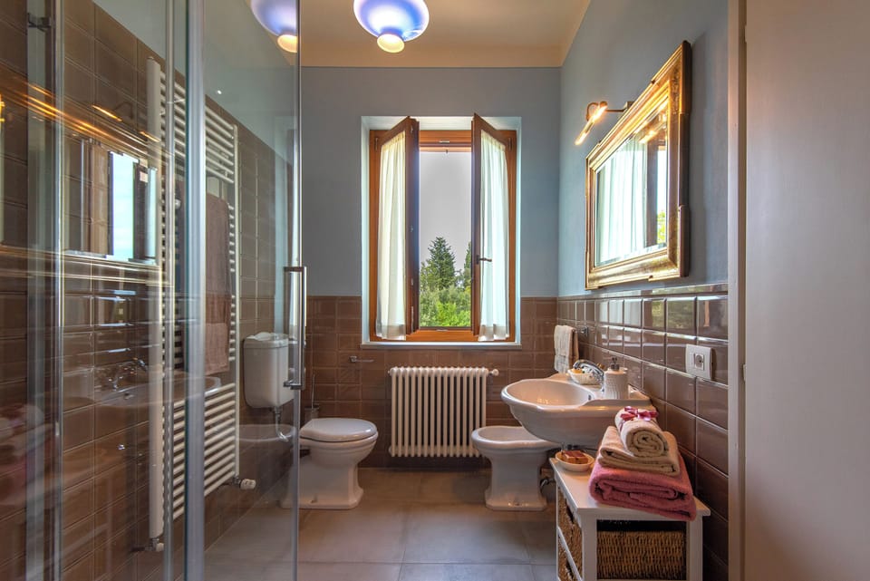 Apartment, Garden View | Bathroom | Shower, hair dryer, towels, soap