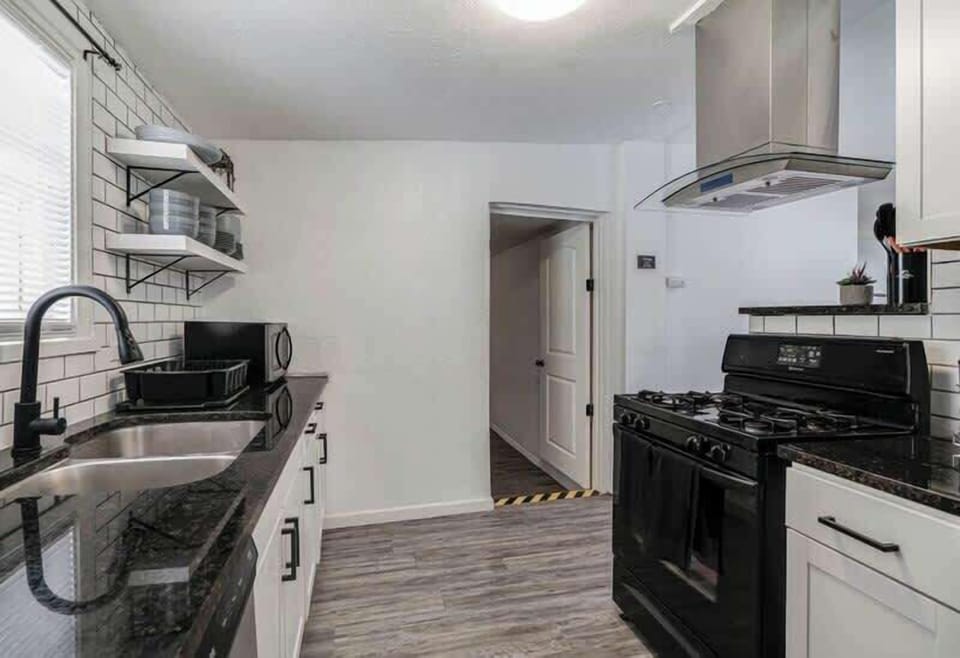 Microwave, doble sink and dishwear.   Door is to Bedroom #3. Small step down into bedroom.
