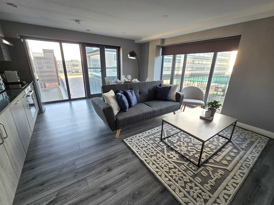 Floor to ceiling windows flood your living space with natural light and stunning waterfront views