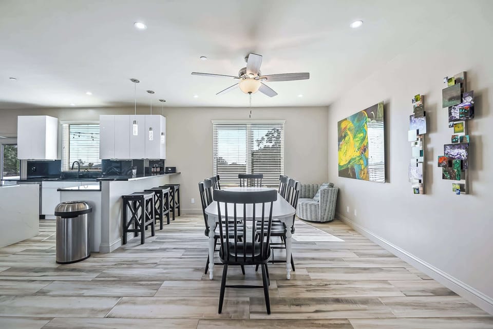 "Our chic dining room offers a blend of modern design and functionality, with high chairs and generous seating for a perfect dining experience."