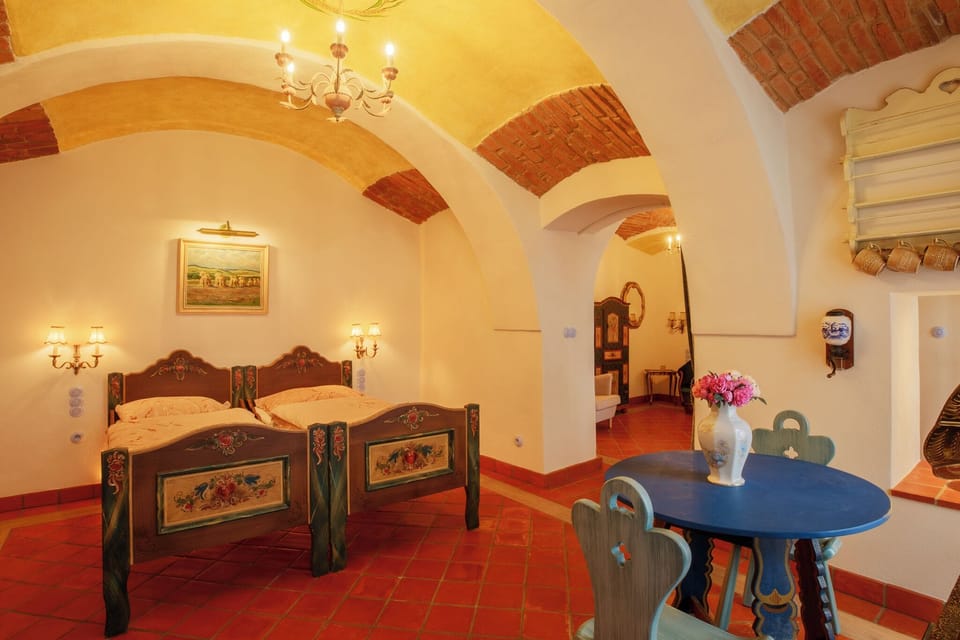 Family Room, Courtyard View | Minibar, individually decorated, laptop workspace, blackout drapes