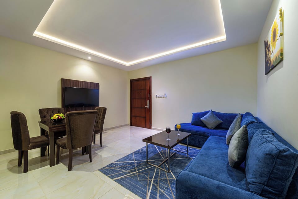 Family Suite | Living area | 50-inch flat-screen TV with digital channels