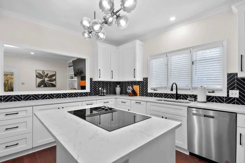 Minimalist design and high-end finishes make this a luxurious cooking spot. 