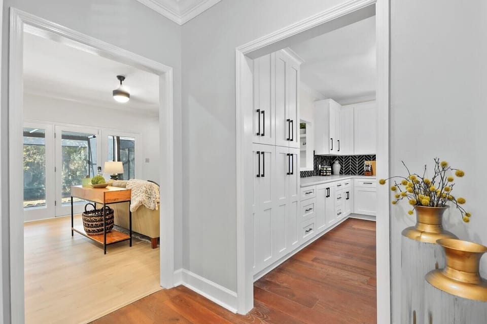The kitchen has a window overlooking the living room, making the space perfect for entertaining. 