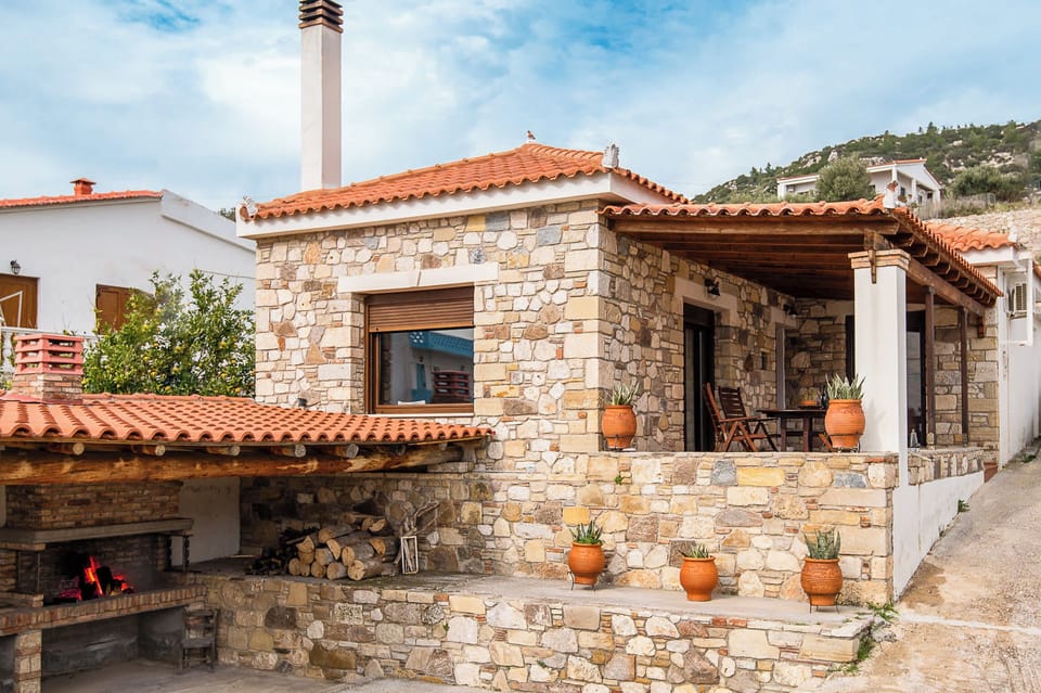 The Facade of the Stone House and BBQ area