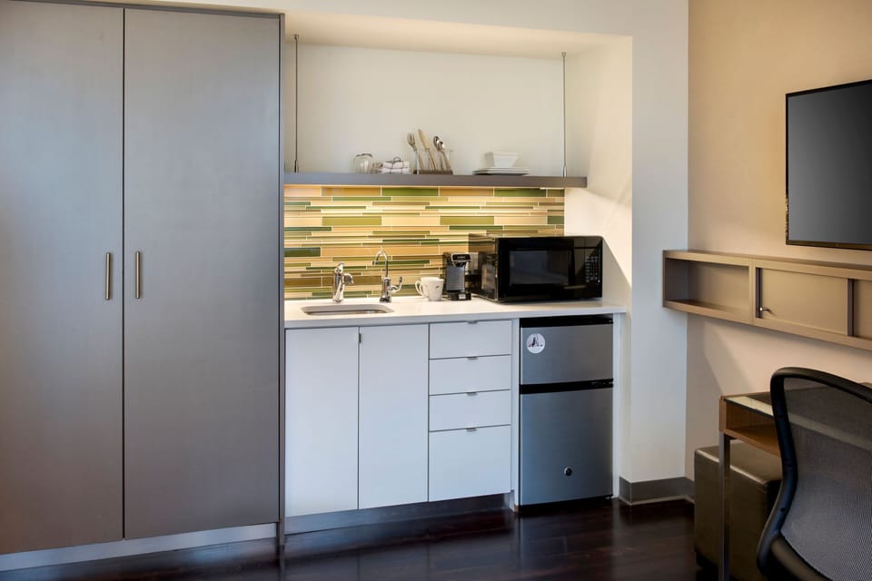 Mini-fridge, microwave, coffee/tea maker, cleaning supplies