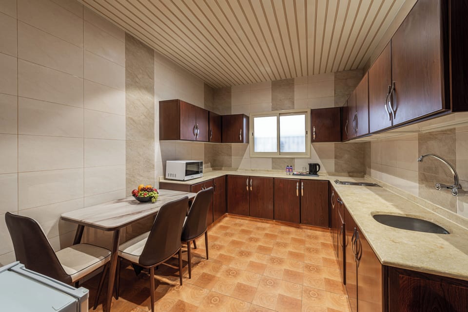 Family Suite | Private kitchen | Mini-fridge, stovetop, electric kettle