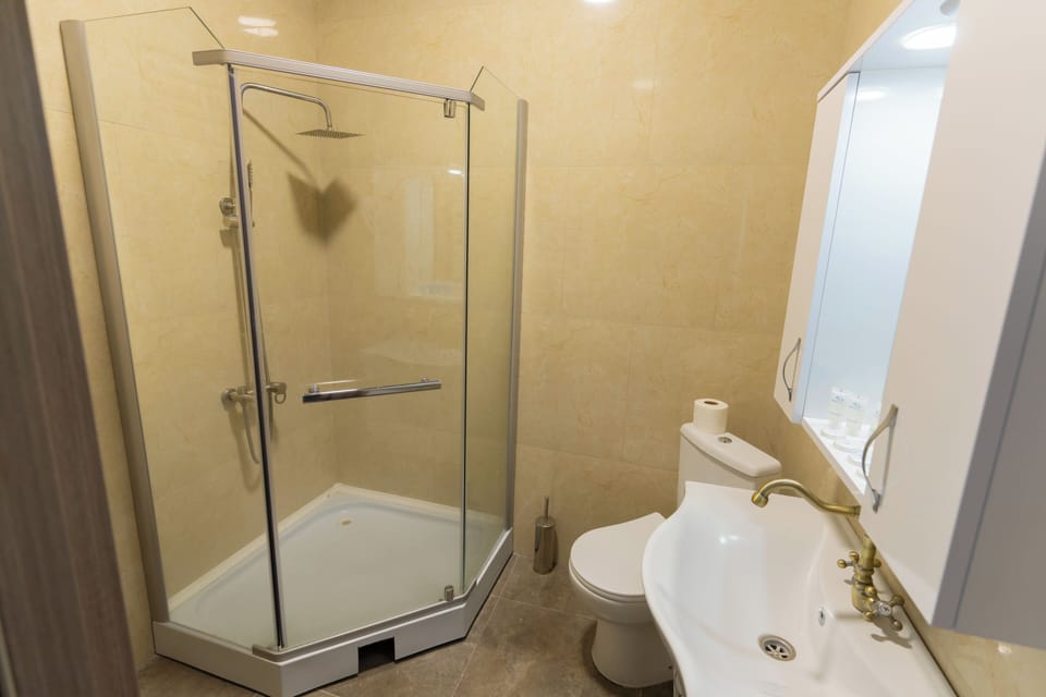 Family Quadruple Room, Balcony, Mountain View | Bathroom | Combined shower/tub, hair dryer, towels, soap