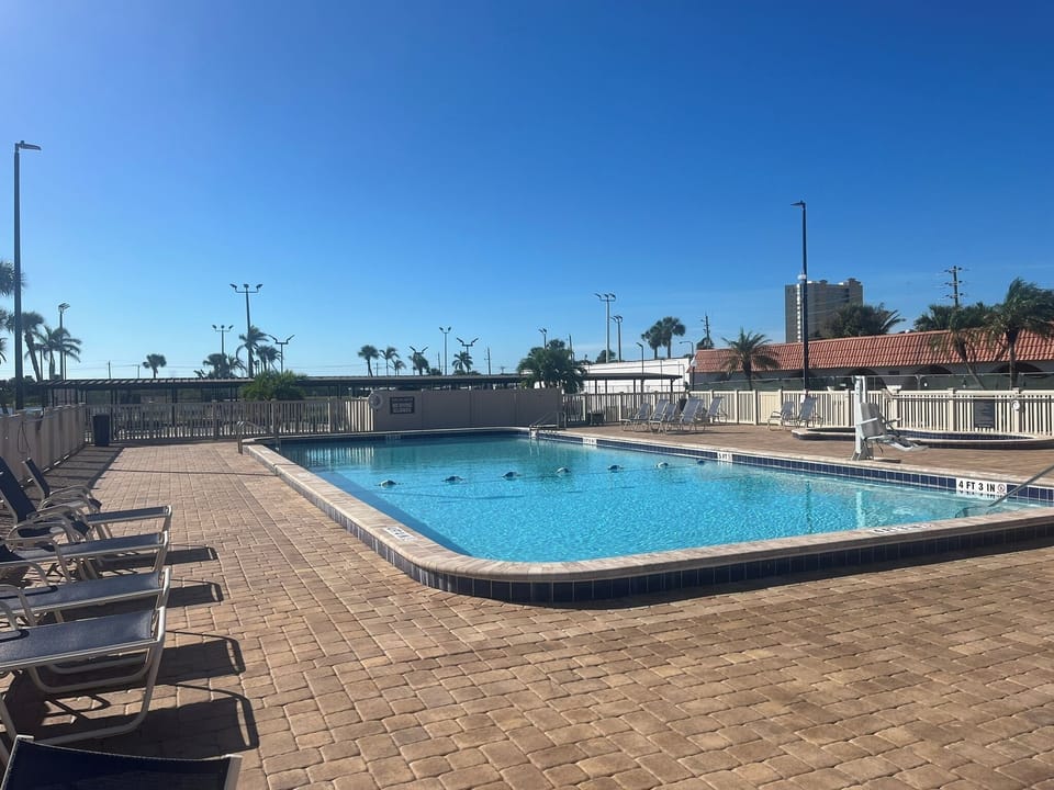 Two pristine swimming pools, hot tub/sauna, gym, Pickleball and tennis courts