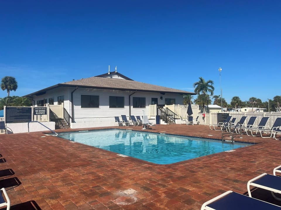 Two pristine swimming pools, hot tub/sauna, gym, Pickleball and tennis courts