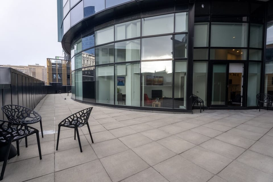 Step outside onto your expansive private terrace—complete with stylish seating and sweeping city views, creating the ultimate backdrop for morning coffee or evening relaxation.