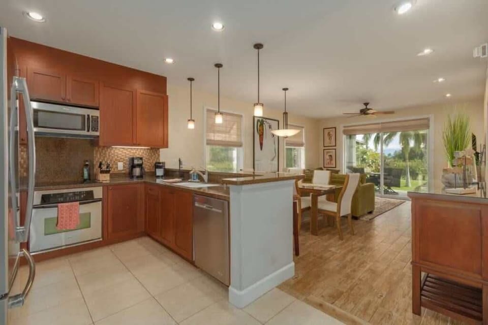 Blend gourmet cooking with open concept living in this stunning kitchen that flows right into paradise.