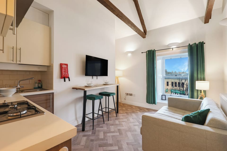 Apartment, City View | Living area | 30-inch TV with cable channels