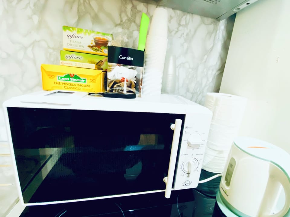 Mini-fridge, microwave, electric kettle, cookware/dishes/utensils
