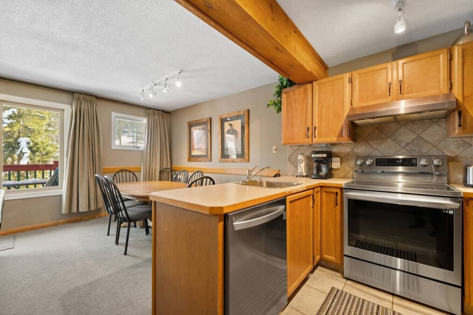Full kitchen with a blender, crockpot/slow cooker & a drip coffee maker.