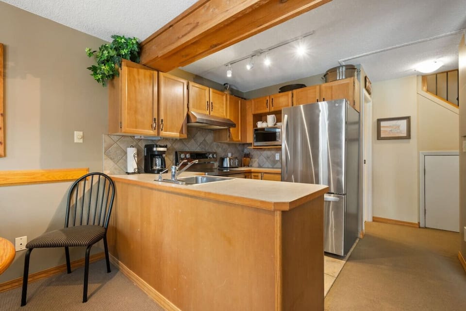 Full kitchen with a blender, crockpot/slow cooker & a drip coffee maker.