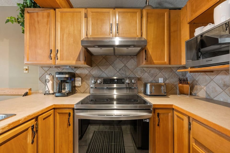 Full kitchen with a blender, crockpot/slow cooker & a drip coffee maker.
