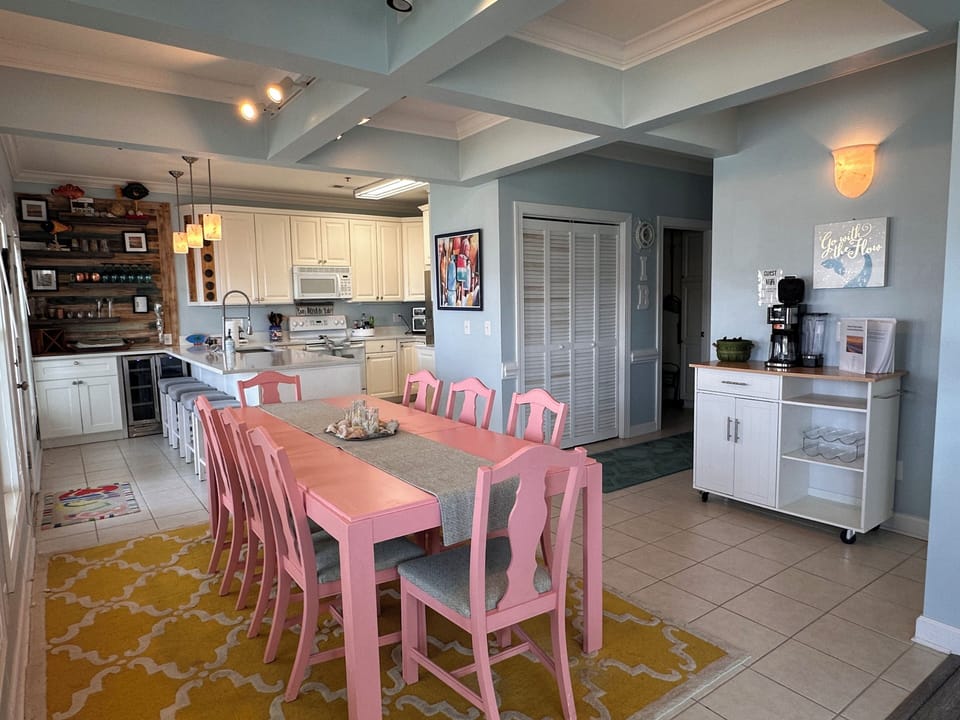 Gather together—dining table seats 8 plus additional seating at the kitchen bar.