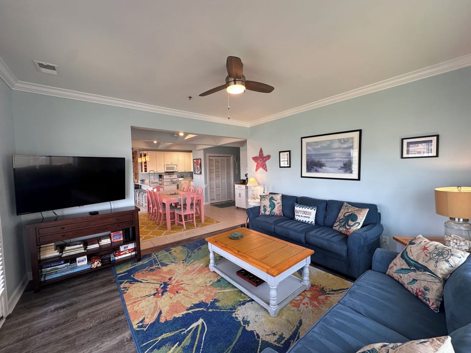 Bright, comfortable living room with plenty of seating for the whole family.