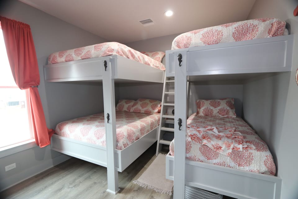 A set of full-size bunk beds. A set of twin bunk beds are available in this room.  All linens available