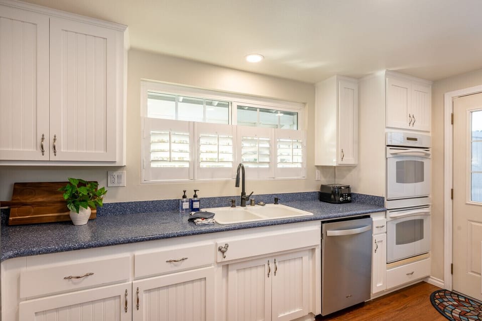 Made for easy group meals and holiday-style dinners, the spacious kitchen offers plenty of room to prep, cook, and gather. With double ovens and generous counter space, feeding the whole crew feels simple and stress-free.