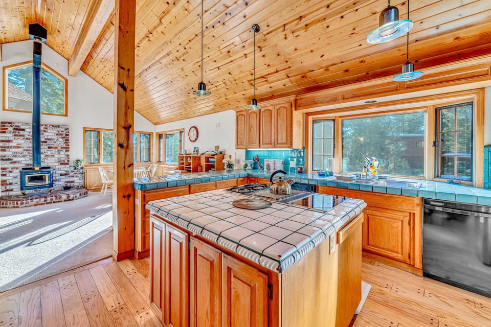 Kitchen: Drip coffee maker, espresso machine, cooking utensils, tableware, main floor