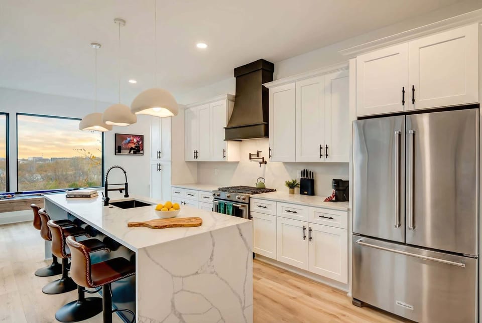 Welcome to this chic, modern kitchen, perfect for cooking and socializing. With stylish décor and ample counter space, it’s ideal for gatherings before exploring Downtown Nashville. Enjoy culinary adventures in this luxurious vacation rental!