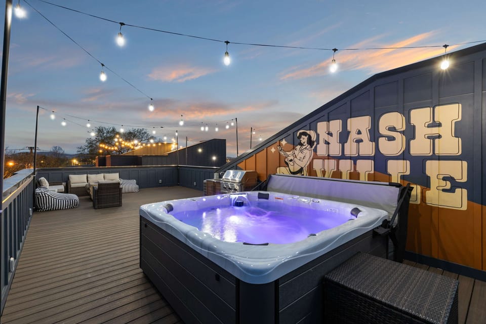 The rooftop hot tub is strung with lights and surrounded by seating, so the group can soak, talk, and watch the city glow together. Reserve your group getaway with Misfit Homes