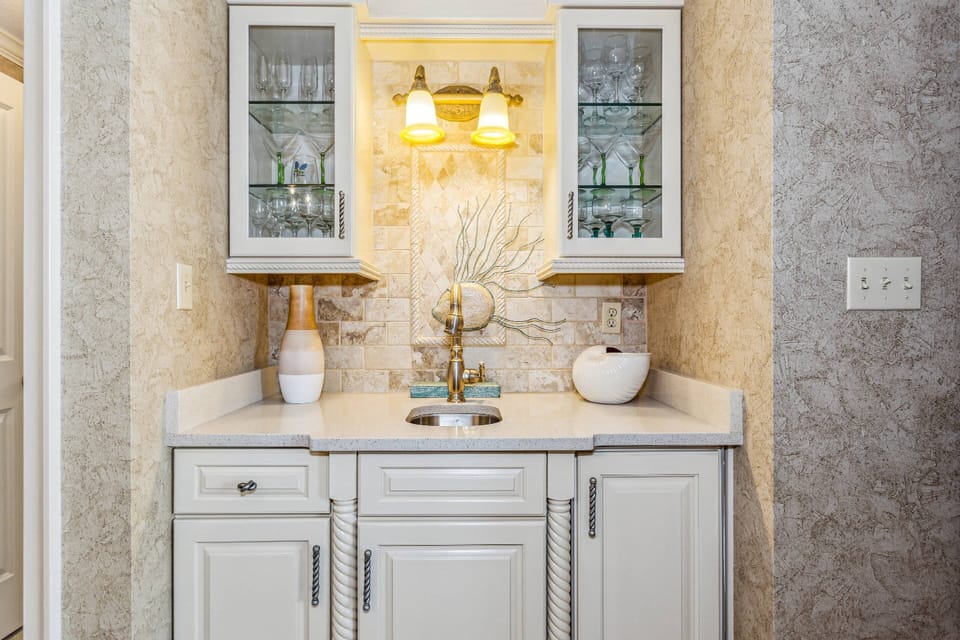 Separate wet bar with mini fridge and sink