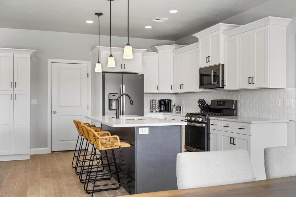 Contemporary kitchen with island bar sink, and seating—perfect for entertaining